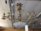 a chandelier that is hanging from the ceiling in a store