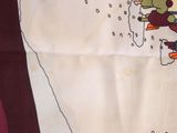 a picture of a table cloth with a picture of a snowman on it