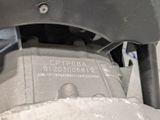 a close up of a motorcycle engine with a number plate on it