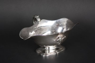 an antique silver plated bowl with a bird on top