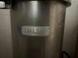 an image of a stainless steel pot with a sticker on it