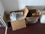 many boxes of items sitting on the floor next to a door
