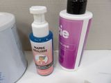 a bottle of deodorance and a container of deodorance on a counter