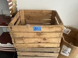 three wooden crates sitting on the floor next to each other