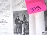 a pink post it on top of an open book