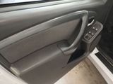 the interior of a car with the door open and the driver ' s side door open