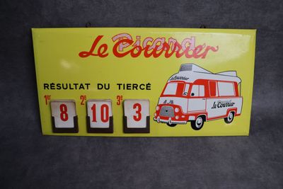 panneau jaune sur lequel figure un bus rouge et blanc et où est inscrit « Le Couver »