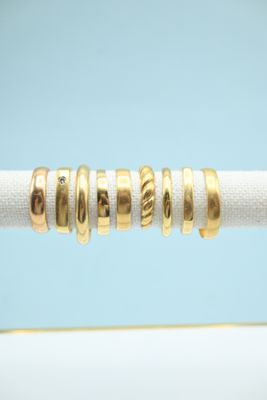 an image of a close up of a gold ring on a rope
