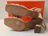 an image of a pair of women ' s shoes with a box in the background