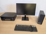 a desktop computer, keyboard, mouse and monitor on a desk