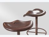 an image of a pair of brown leather stools on a white background