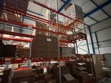 boxes are stacked on pallets in a warehouse with a sky background