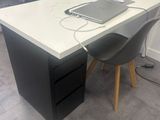a desk with a laptop on it in a room
