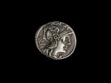 une pièce d'argent sur laquelle figure une tête de femme