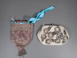 two purses that are sitting next to each other on a table