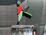 a car seat with a bottle of water and a keychain attached to it