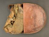 an old baseball mitt with a glove inside of it on a table