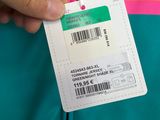 a person holding a name tag with a barcode on it