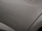 a close up of a car ' s door handle with a sticker on it