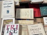 many books that are on a table in a room