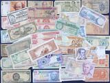 many different types of paper money on the table