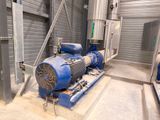 a blue blower sitting inside of a building next to a wall