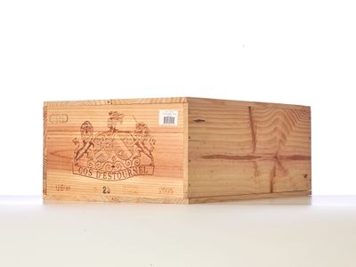 a wooden box with a label on it sitting on a table