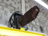 a large piece of luggage hanging from the side of a building