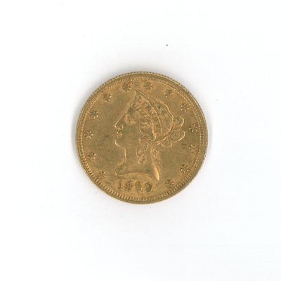 une image d'une pièce d'or sur une surface blanche
