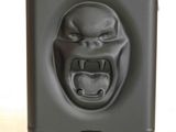 an image of a black suitcase with a face on it