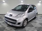 a picture of a small silver car on a checkered floor