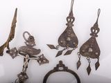 several pieces of jewelry are displayed on a white surface
