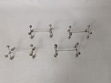 five pairs of silver balls on a white surface