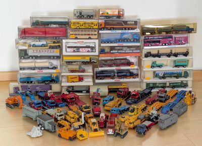 a lot of toy trains that are on the floor