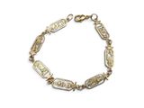 a close up of a bracelet on a white background