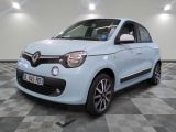 a picture of a small blue car parked in a garage