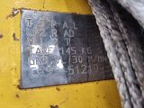 a close up of a metal tag on a piece of equipment
