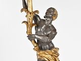 bronze statue of a man holding a harp on a marble base