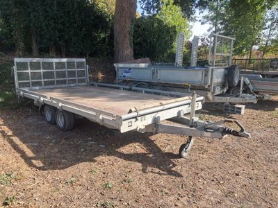 a trailer that is parked in the dirt