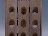 wooden wine rack with six bottles of wine on top of it