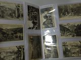 a person holding a book that has pictures of old buildings on it