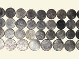 many different types of coins arranged in a row