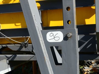 a close up of a yellow and black train on the tracks