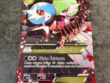 a close up of a pokemon card on a carpet