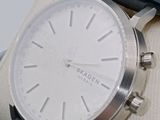 a close up of a watch on display in a box