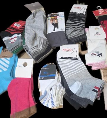 many pairs of socks that are sitting on a table