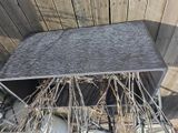 a small table with a bunch of twigs on it