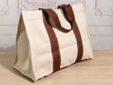 a close up of a bag on a table with a wall in the background