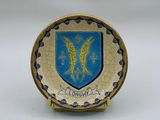 an image of a plate with a coat of arms on it
