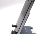 a cell phone that is sitting on top of a stand